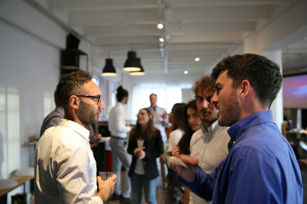 Community members talking during a networking session