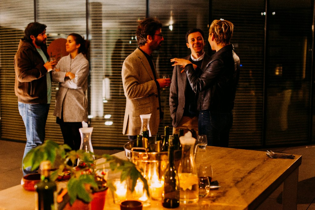 Professionals speaking during an evening chapter event