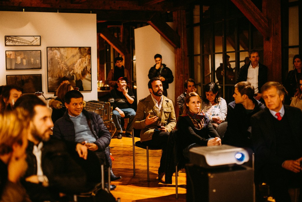 Event attendees engaged in a panel and discussion format